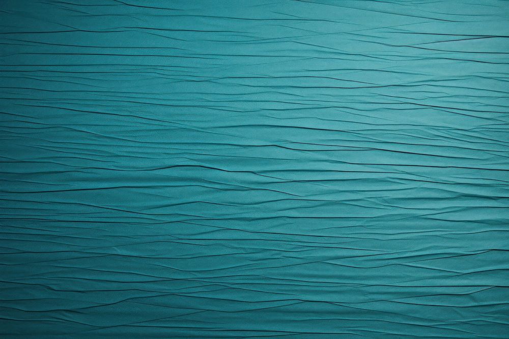 Folded turquoise paper texture paper backgrounds textured abstract.