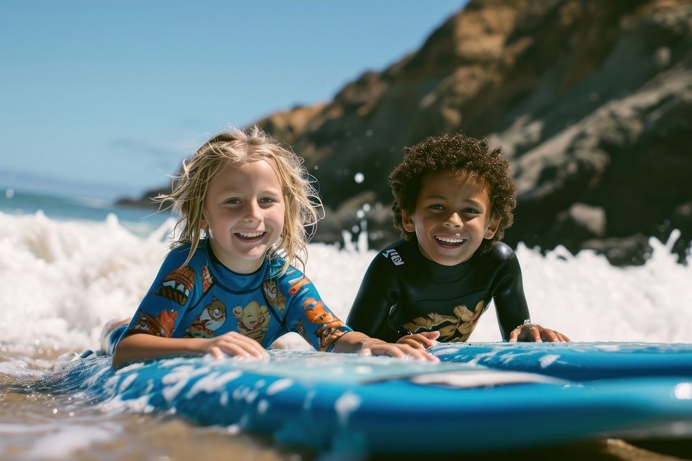 Two diversity cool kids surfing outdoors sports nature.