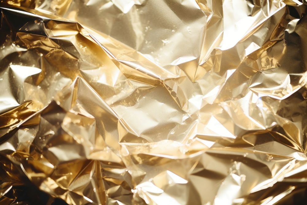 Crumped foil backgrounds metal gold. AI generated Image by rawpixel.
