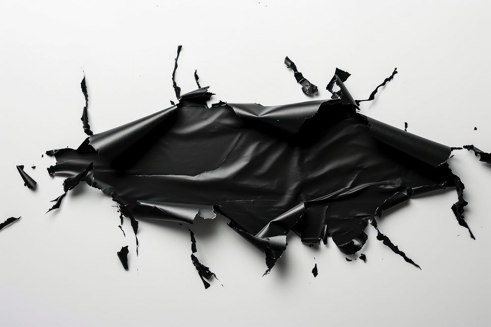 Smooth black plastic wrap transportation destruction splattered.