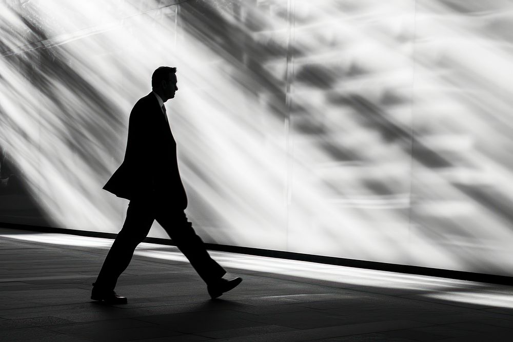 Silhouette Black and white isolate business guy walking motion black.