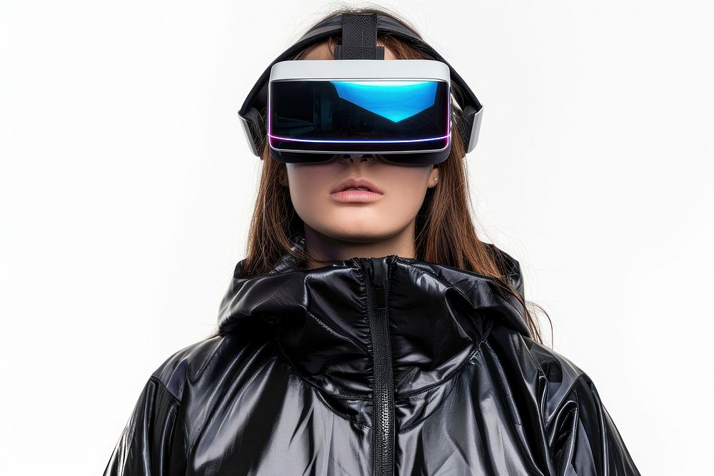 Woman wearing VR glasses with costume futuristic style jacket white background accessories.
