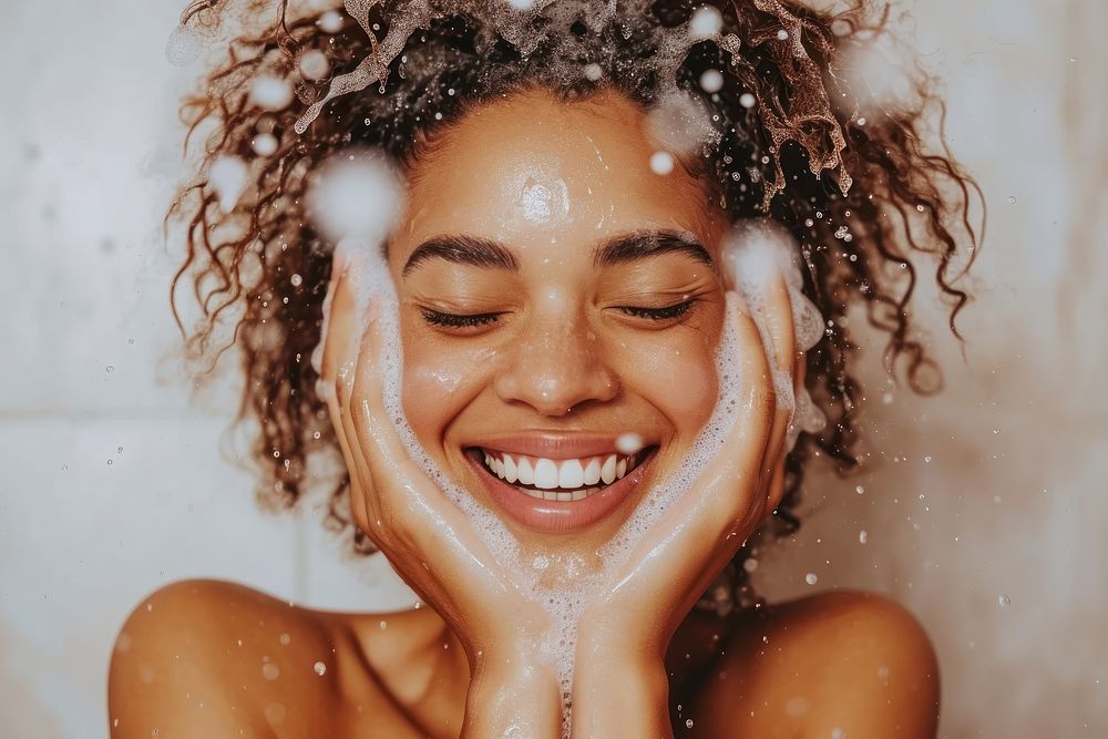 A happy black girl washing hair bathroom bathing adult.