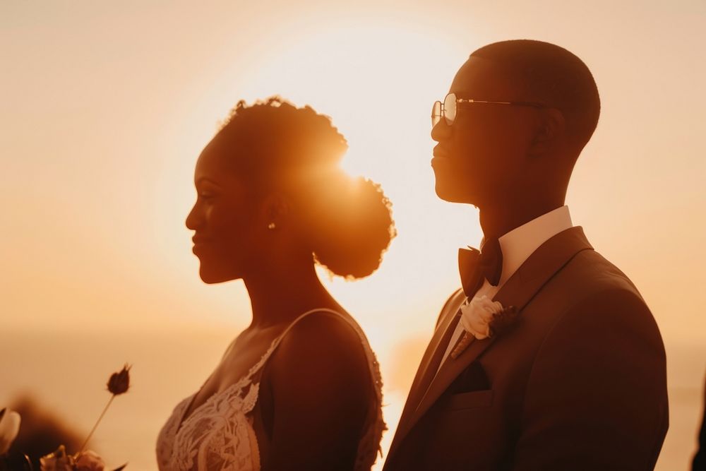 Black people in elopment wedding ceremony outdoors sunset nature.