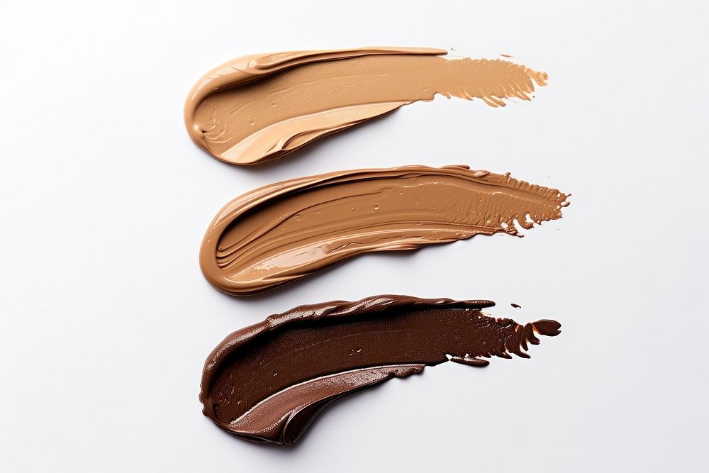 Chocolate brown white background cosmetics.