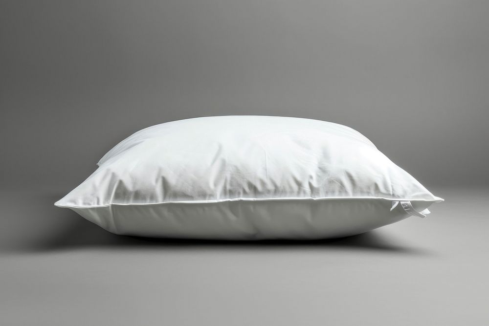 An empty white pillow furniture cushion bed.