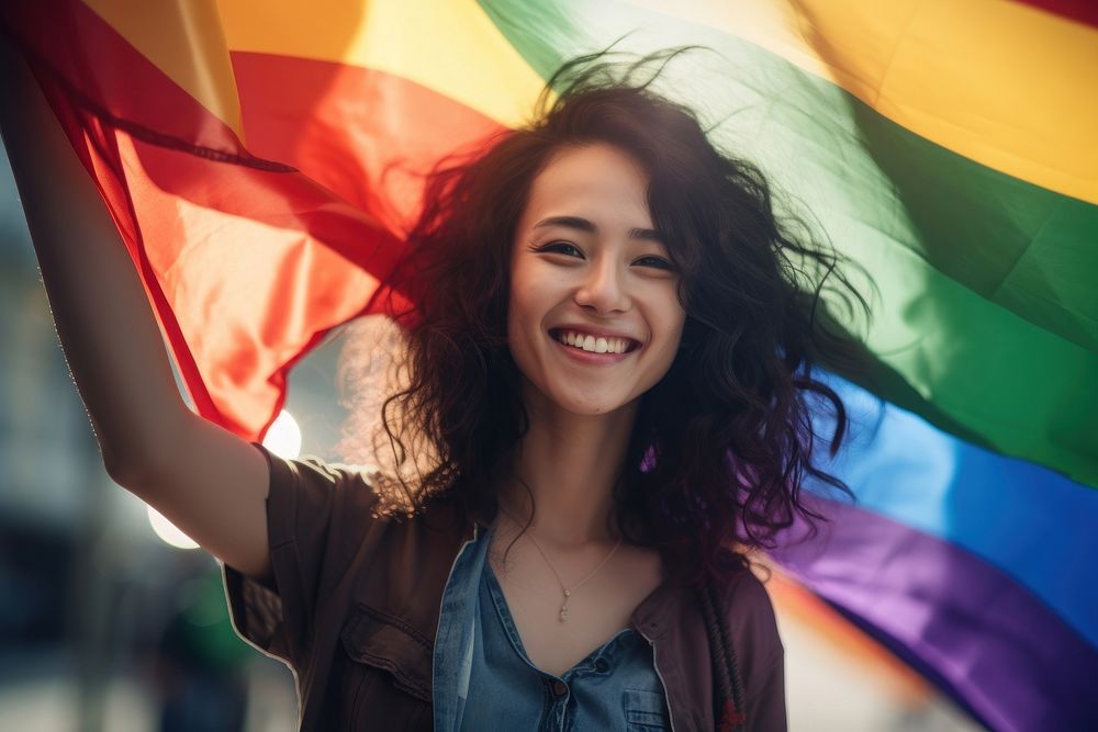 Taiwanese woman holding rainbow pride.