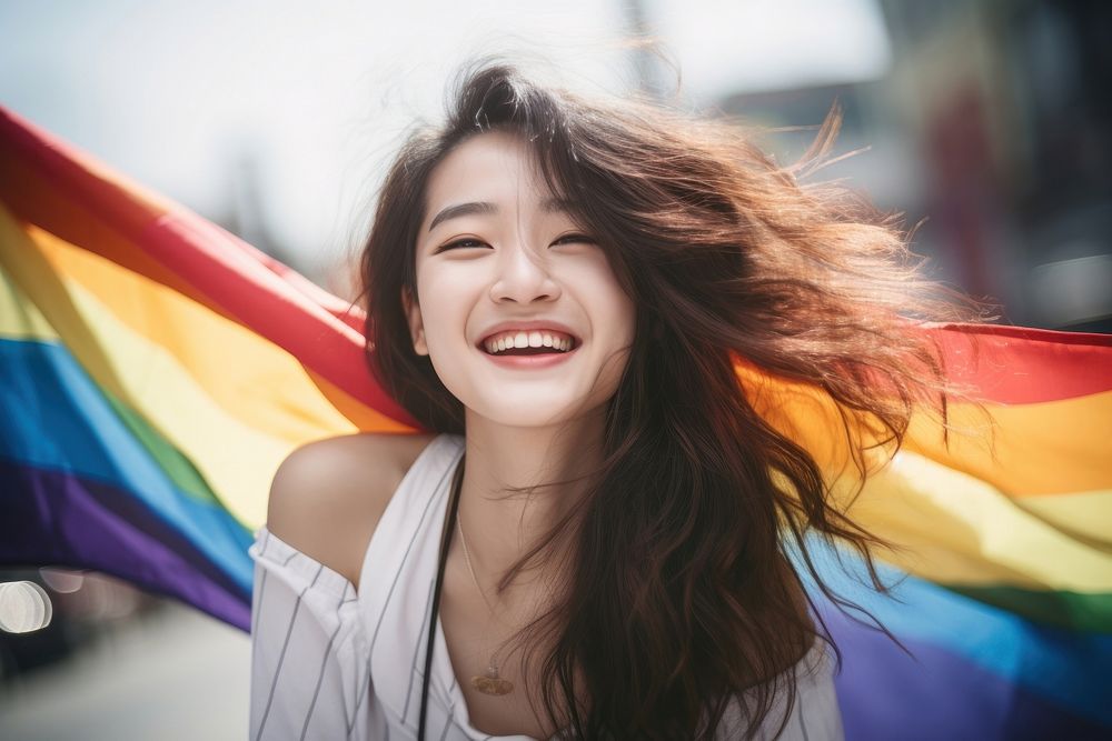 Taiwanese woman laughing rainbow smile.
