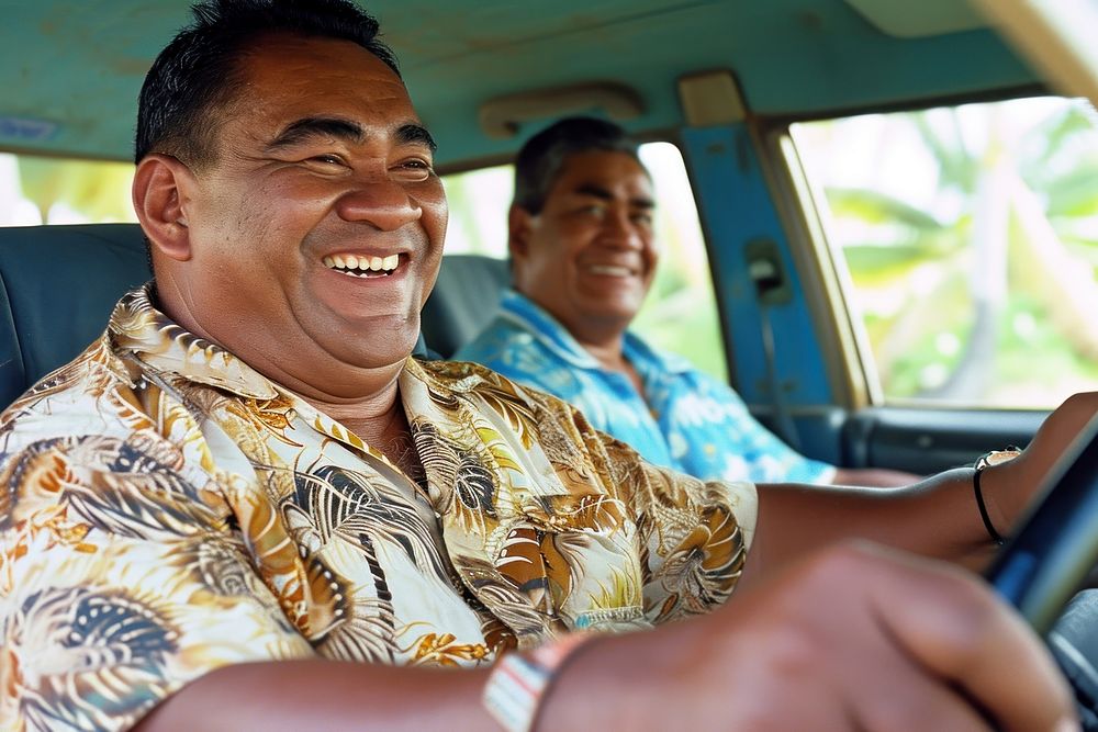 Samoan friends driving laughing vehicle.