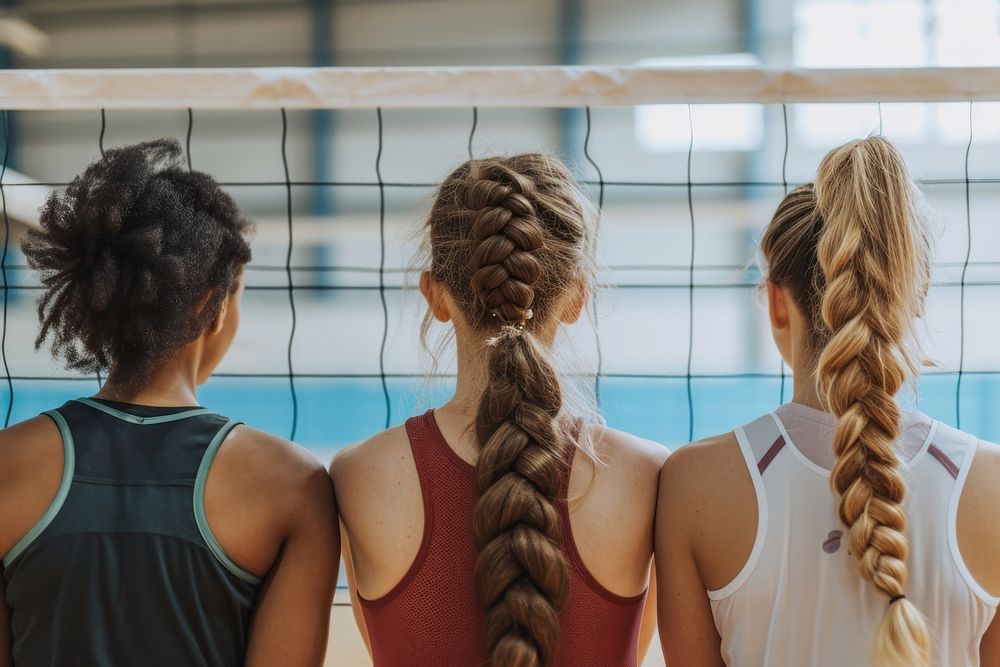 Volleyball team braid back exercising.