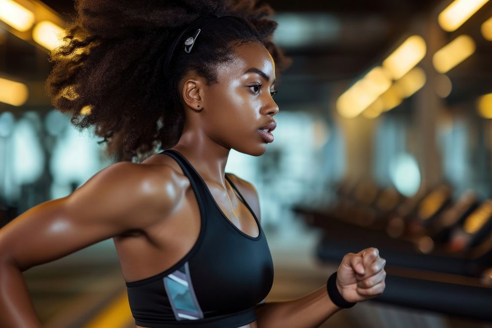 Black women running in the gym adult determination concentration.