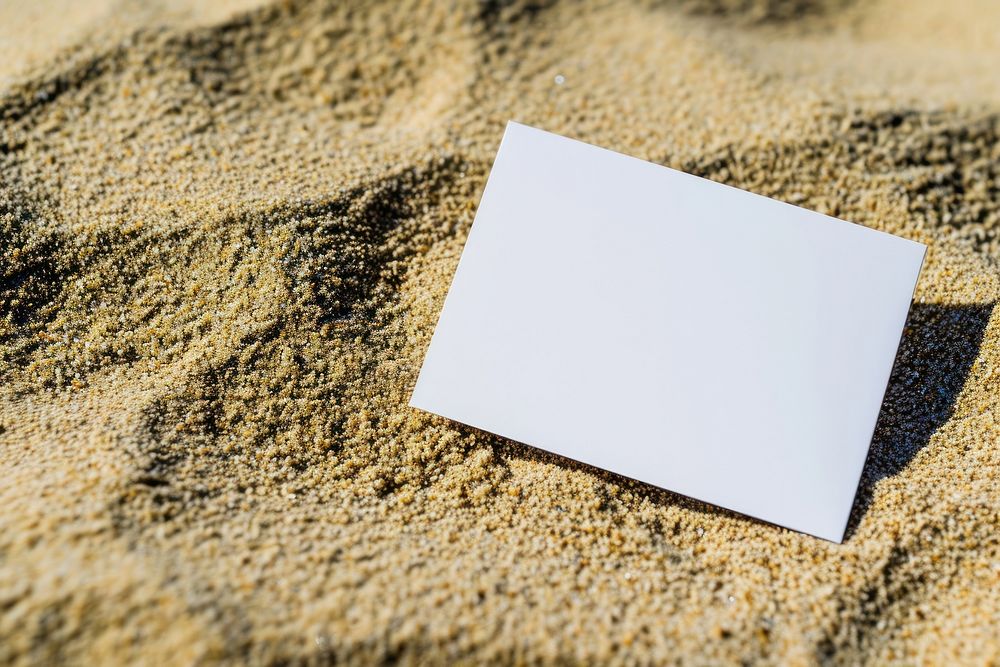 Business card sand outdoors paper.