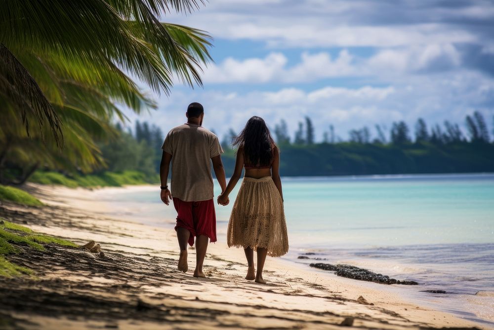 Couple from Tonga vacation walking island.