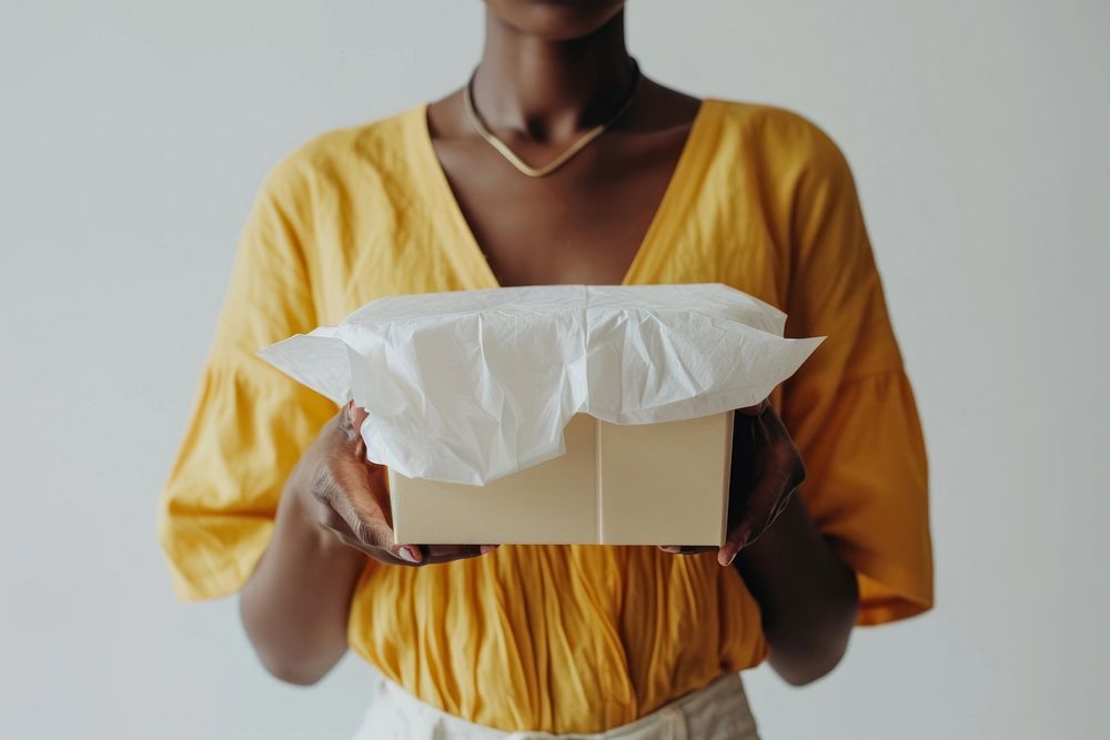 Afican woman put food box cardboard adult white.