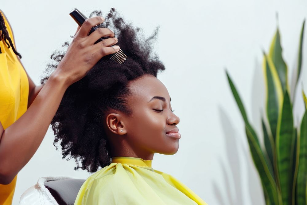 African afro woman sit in salon shop portrait adult hairdresser.