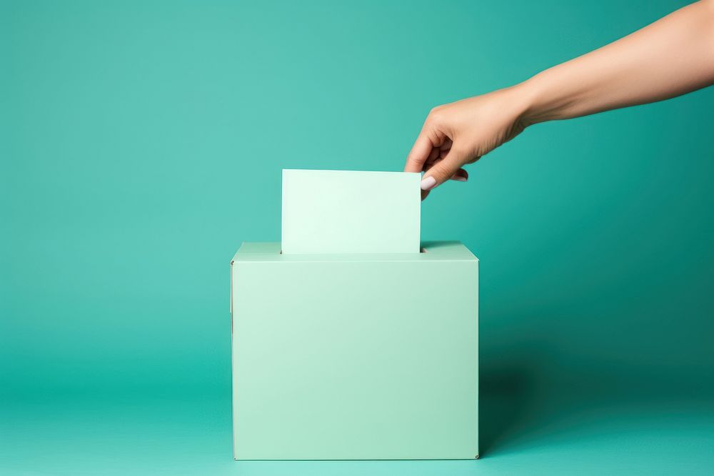 Paper voting box green hand.