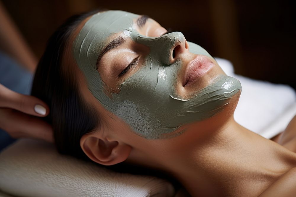 Woman getting a facial mask adult face spa.