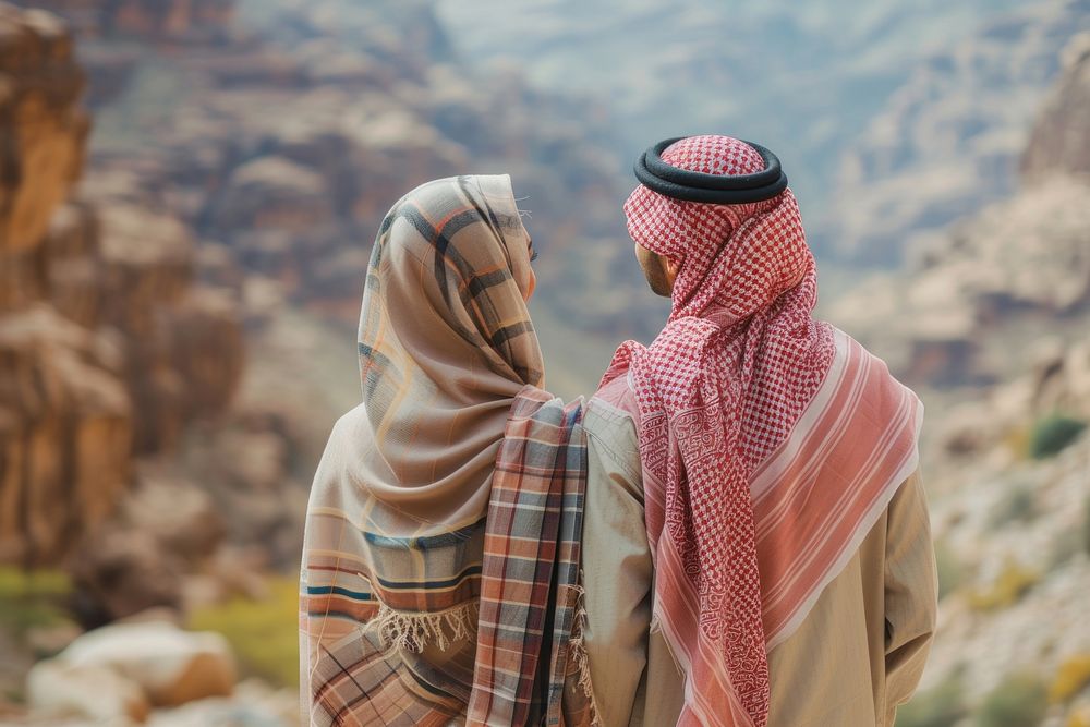 Middle eastern couple standing in mountain together scarf love togetherness.