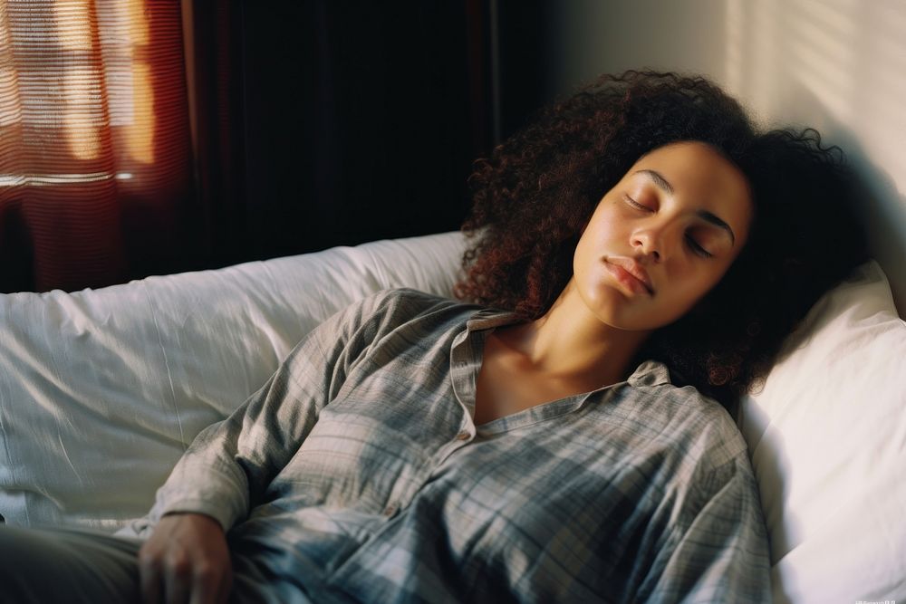 A mixed race american-african woman sleeping bedroom adult.