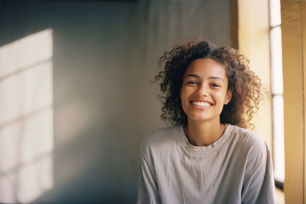 A mixed race american-african woman smiling smile adult.