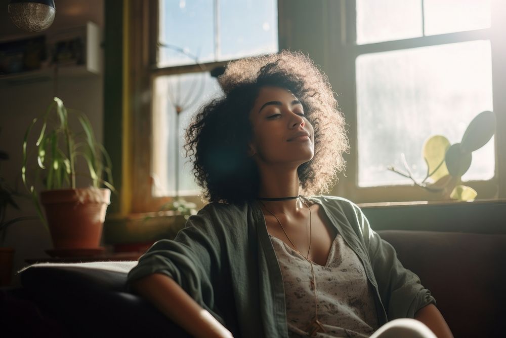 A mixed-race black woman relaxing in living room adult day contemplation. AI generated Image by rawpixel.