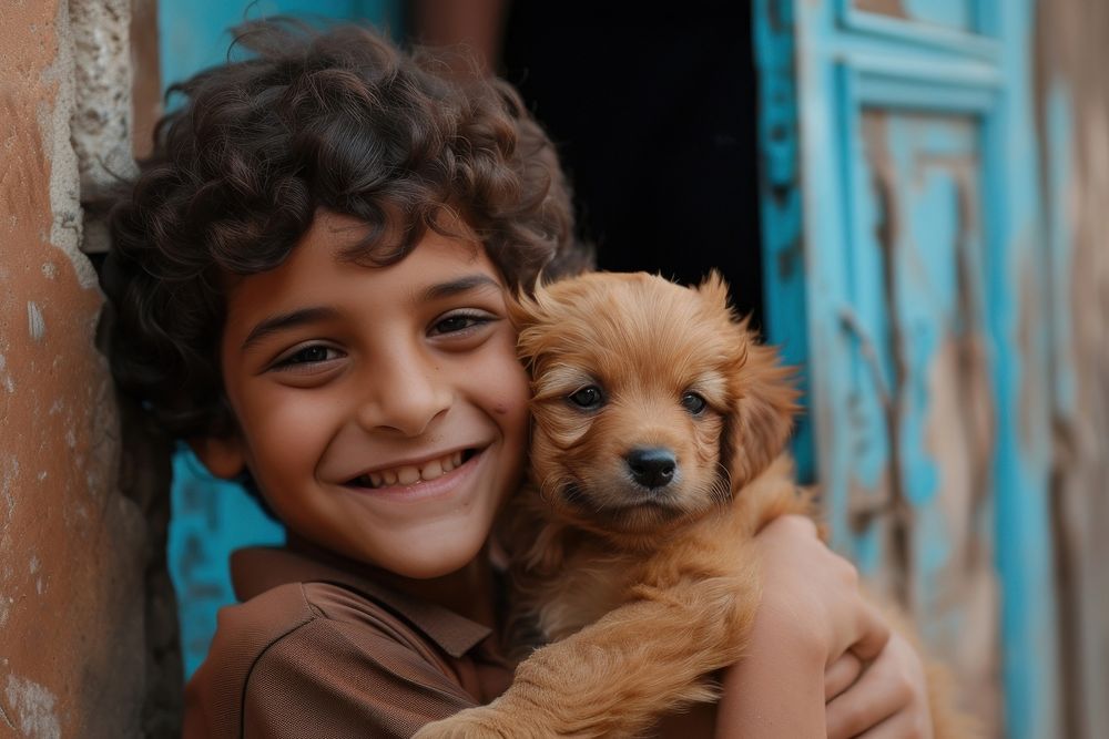 Middle eastern boy plating with puppy portrait smiling mammal.