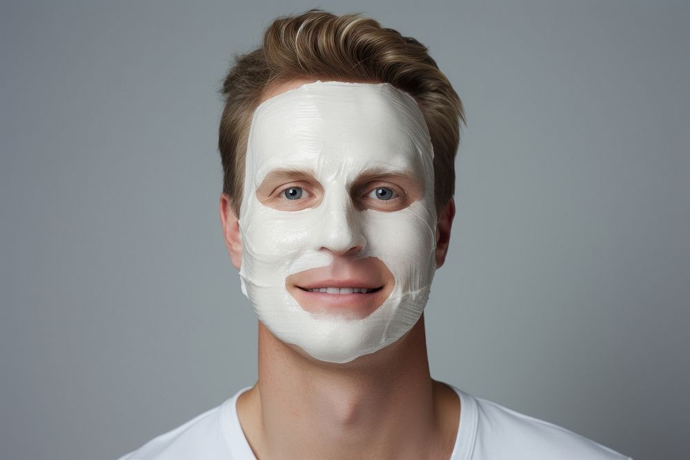 Close-up facial mask smiling portrait of a man with a face mask photography adult studio shot. AI generated Image by…