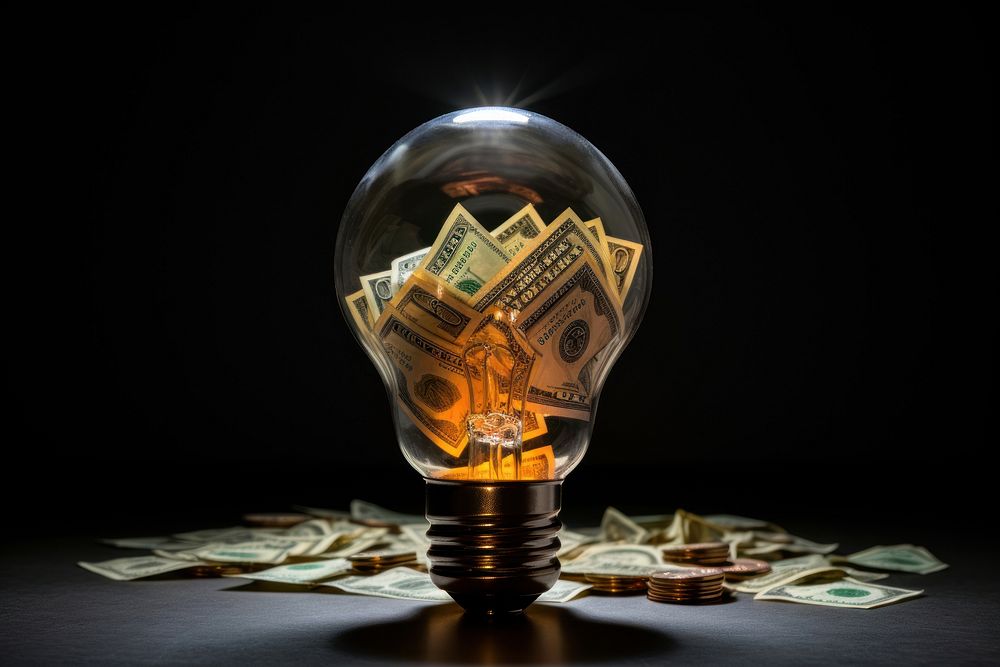 Light bulb with money lightbulb electricity illuminated.