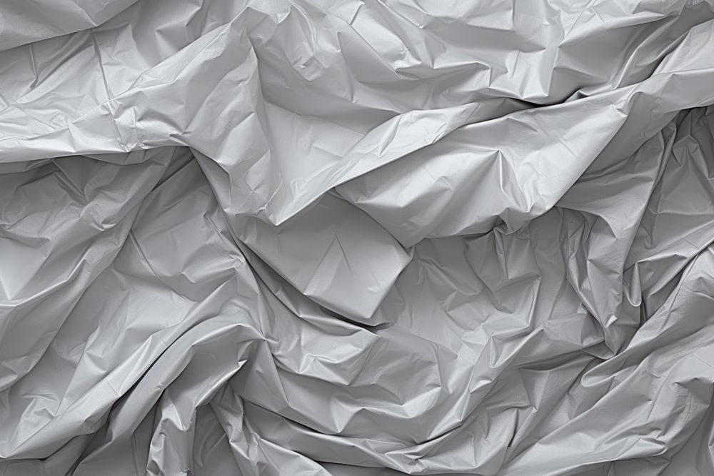 Light gray color crumpled plastic texture background backgrounds paper monochrome. AI generated Image by rawpixel.