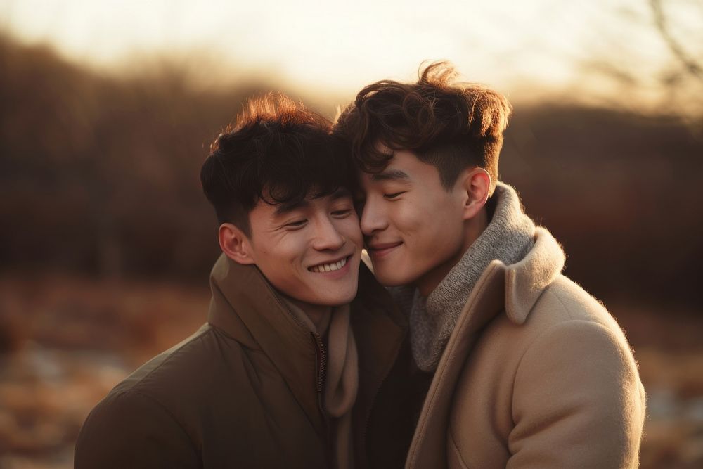Korean gay couple hugging outdoors portrait adult.