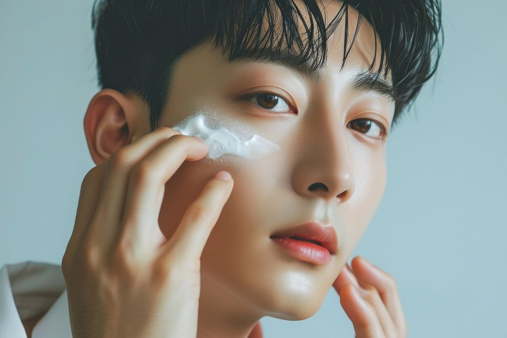 Korean man cosmetics applying skin.