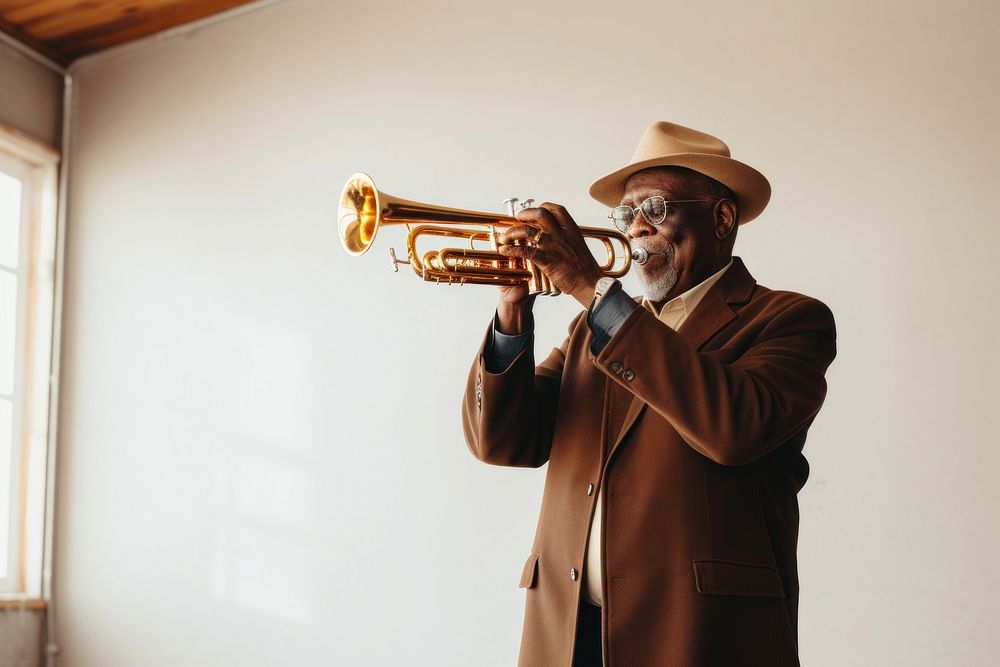 Black senior man holding trumpet musician photo saxophonist. AI generated Image by rawpixel.