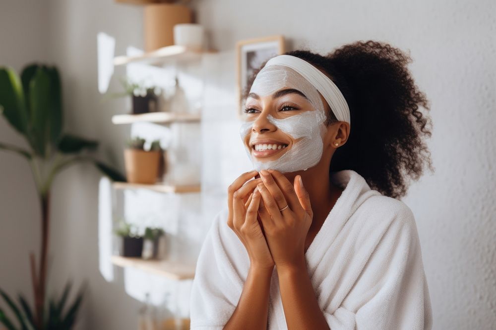 Applying face mask adult woman skin.