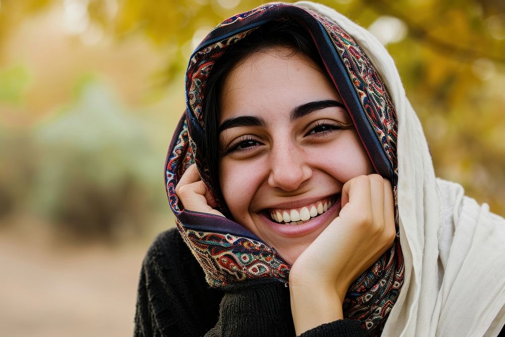 Young smiling middle eastern woman with scarf laughing smile happy.
