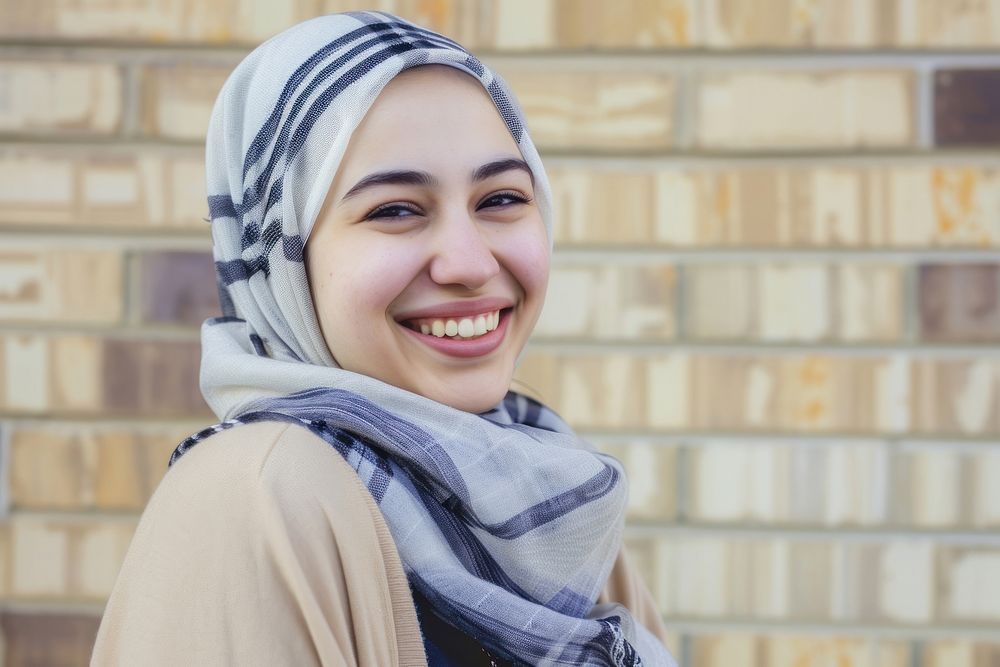 Young smiling middle eastern woman with scarf smile happy architecture.