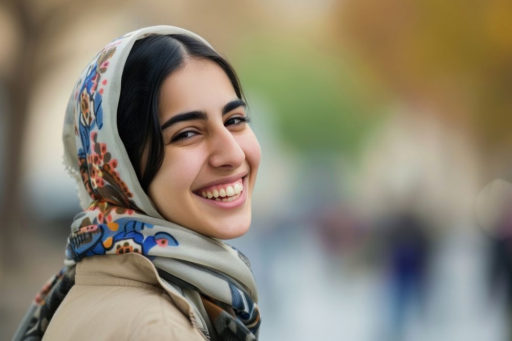 Young smiling middle eastern woman with scarf adult smile happy.
