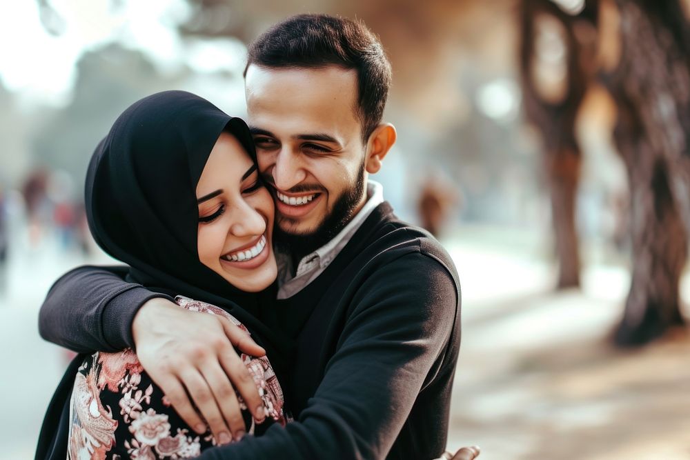 Young wealthy middle eastern couple hugging adult happy.