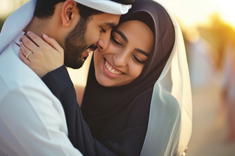 Young wealthy middle eastern couple portrait wedding hugging.