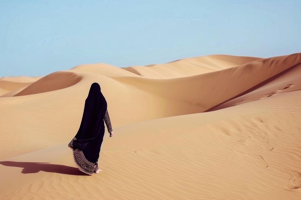 Middle eastern woman desert outdoors walking.