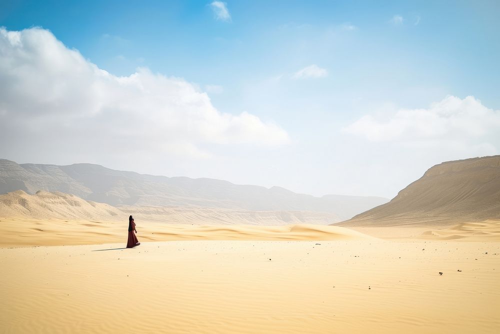 Middle eastern woman desert landscape outdoors.