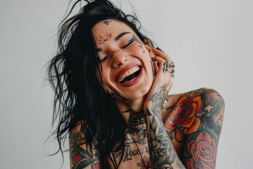Woman covered with tattoo laughing smile individuality happiness. AI generated Image by rawpixel.