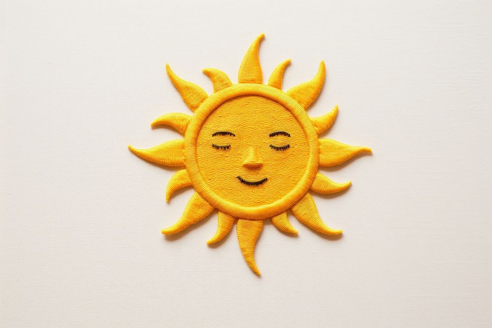 A sun in embroidery style face anthropomorphic representation.