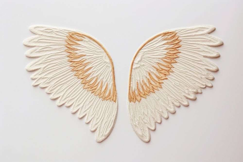 Wing in embroidery style white art creativity.