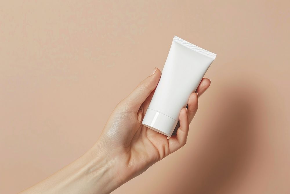 Skincare holding hand toothpaste.