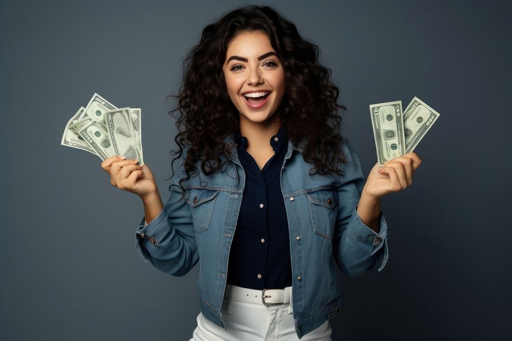 Young woman holding money banknotes cheerful portrait adult.