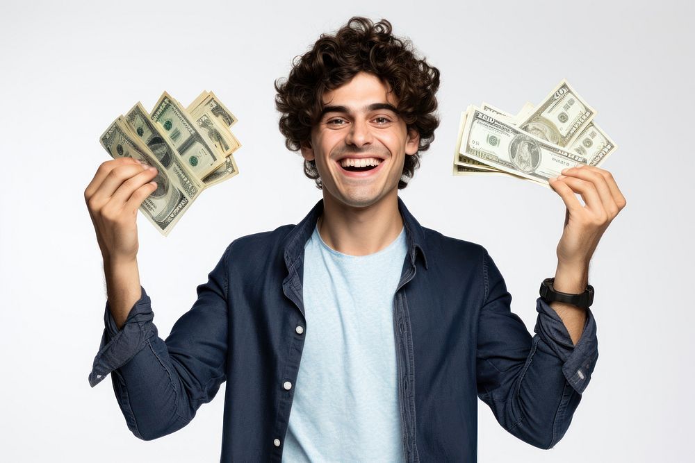 Young man holding money banknotes cheerful portrait dollar.