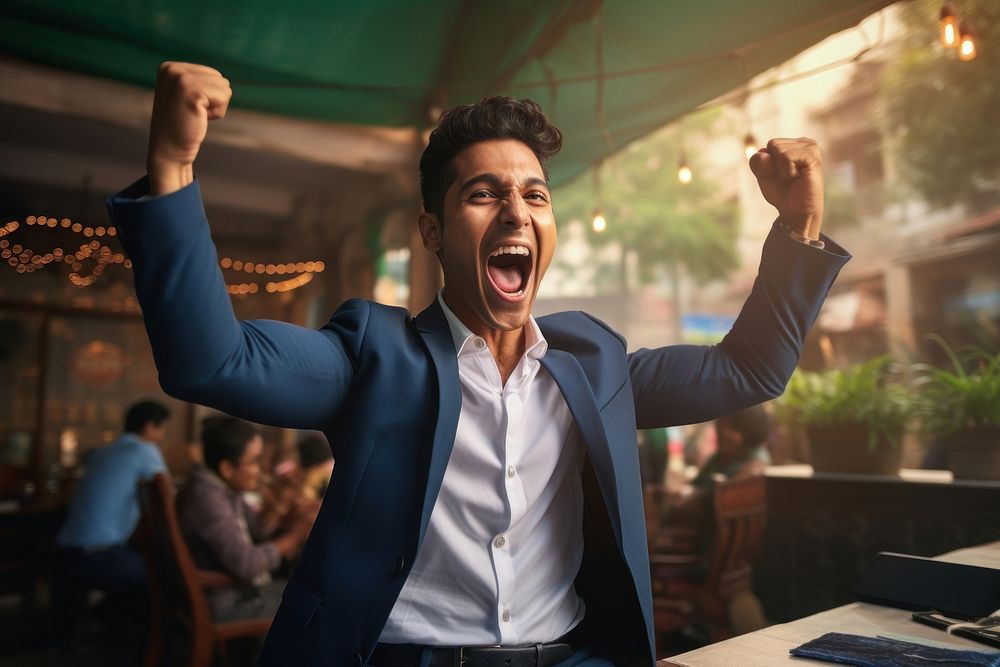 Happy young indian man shouting success adult.