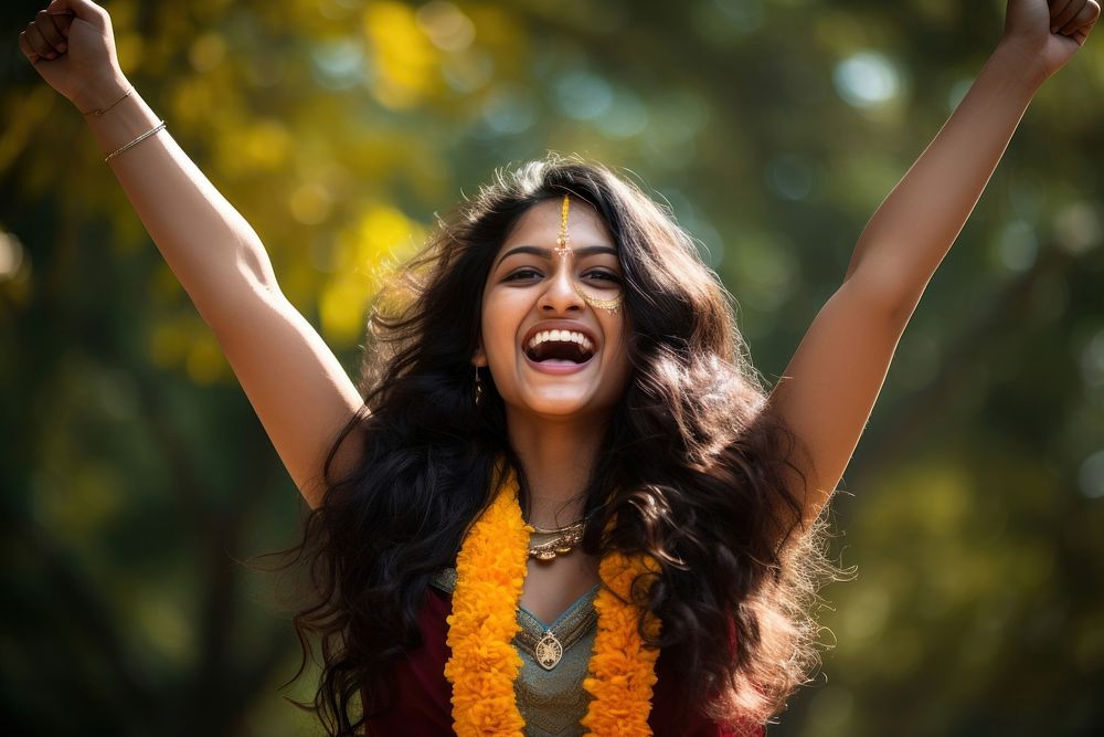 Happy young indian woman laughing celebration accessories.