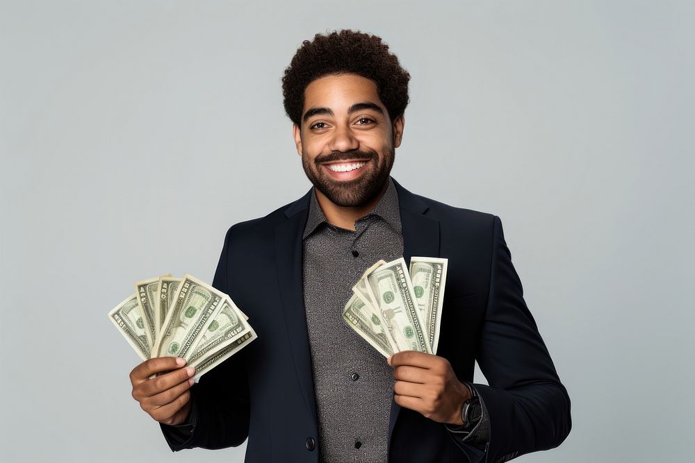 Affrican american businessman holding a fan of bank notes money smile adult.