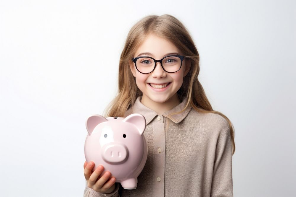 Girl holding his piggy bank glasses smile happy.